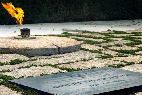 John F. Kennedy's grave with an eternal flame at Arlington National Cemetery