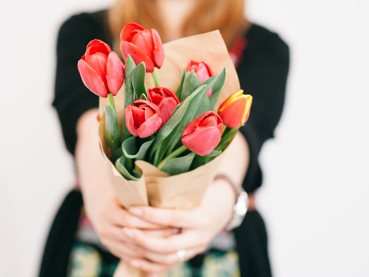 Woman Holding Bouquet of Tulips